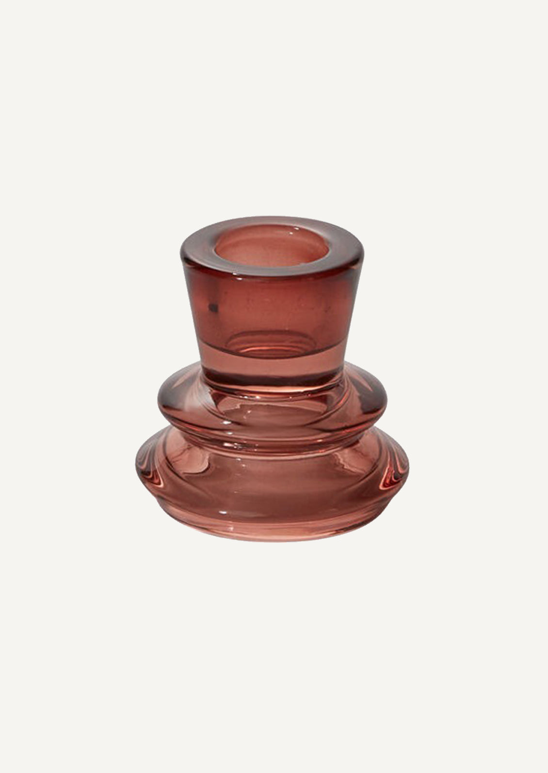A burgundy colored glass taper candle holders with tapered geometric shape.