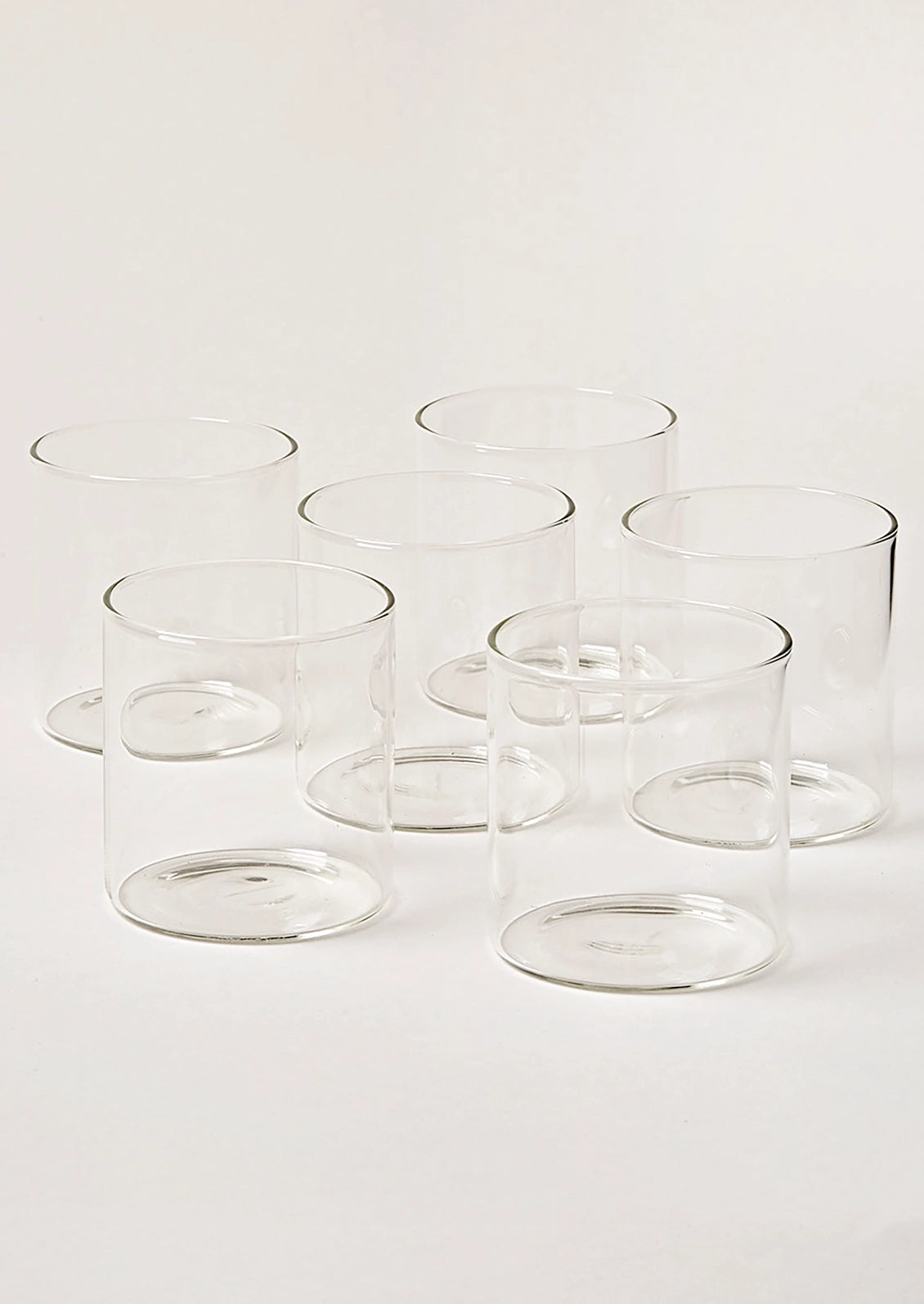 A grouping of clear double old fashioned glasses.