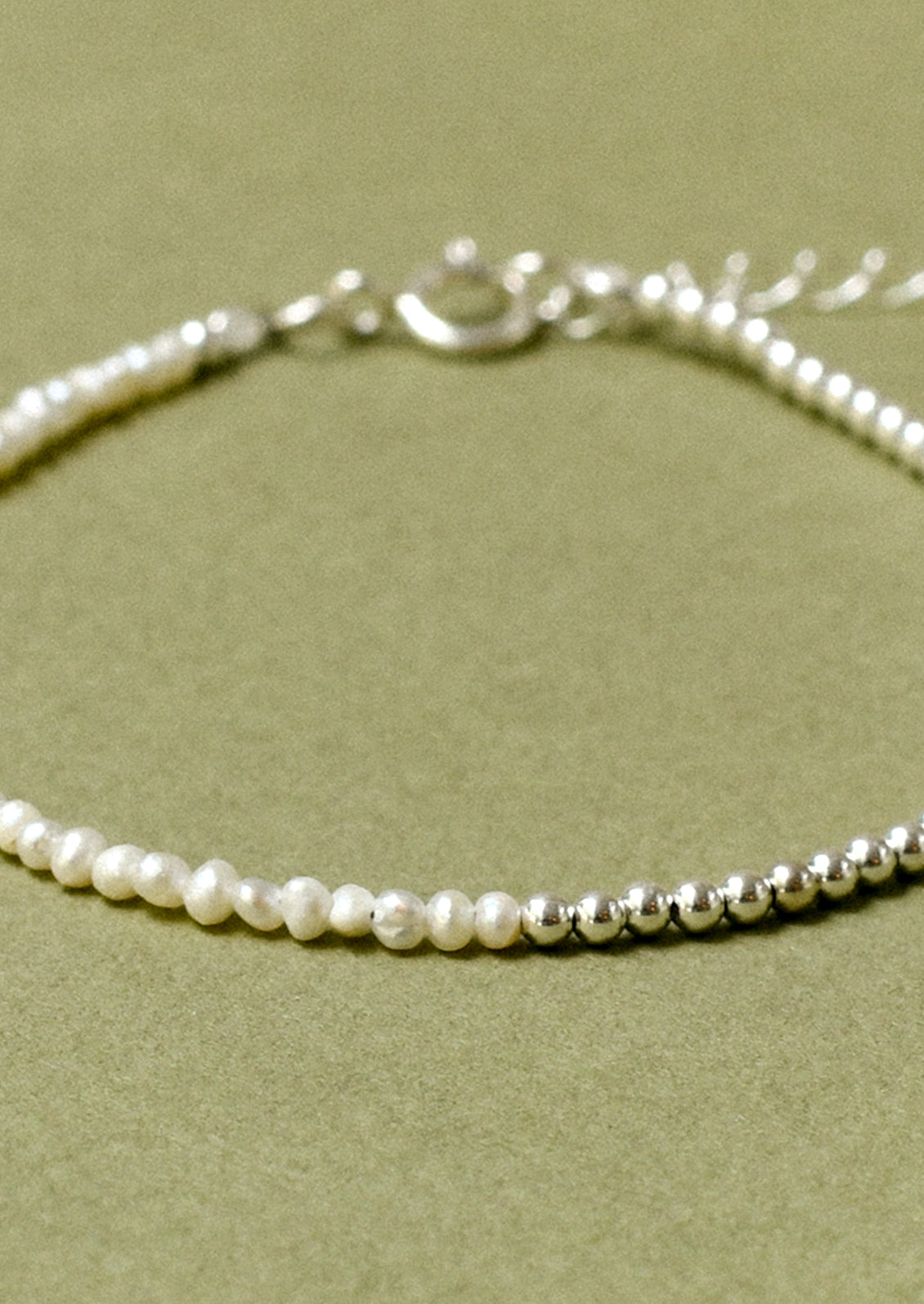 A bracelet with sterling silver beads and small freshwater pearls.