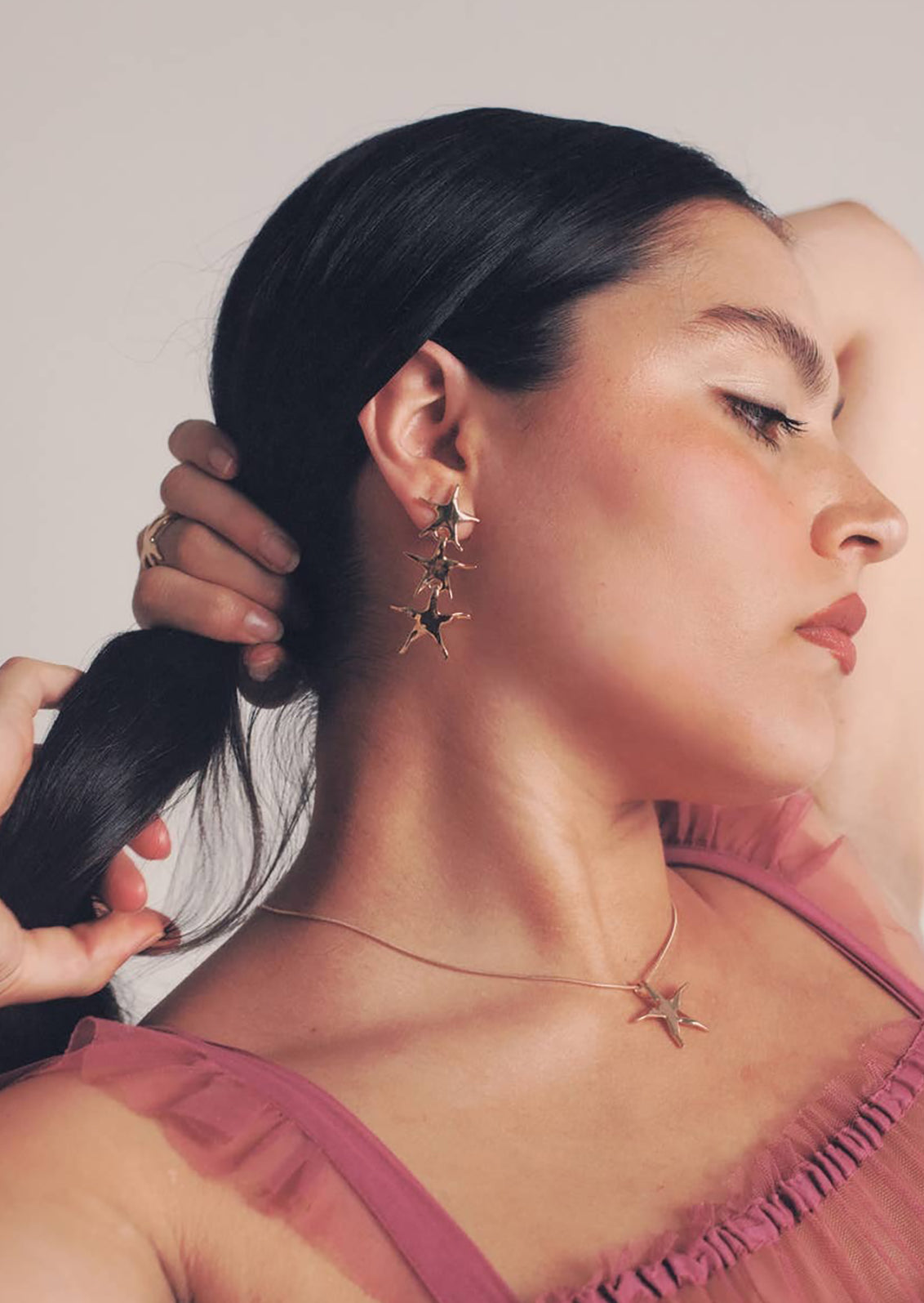 A pair of stacked star earrings in silver.