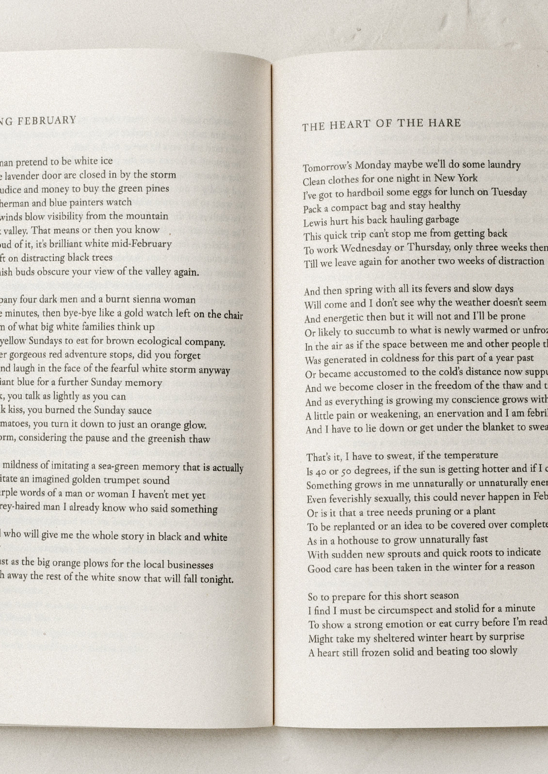 An open book with poems in black text.