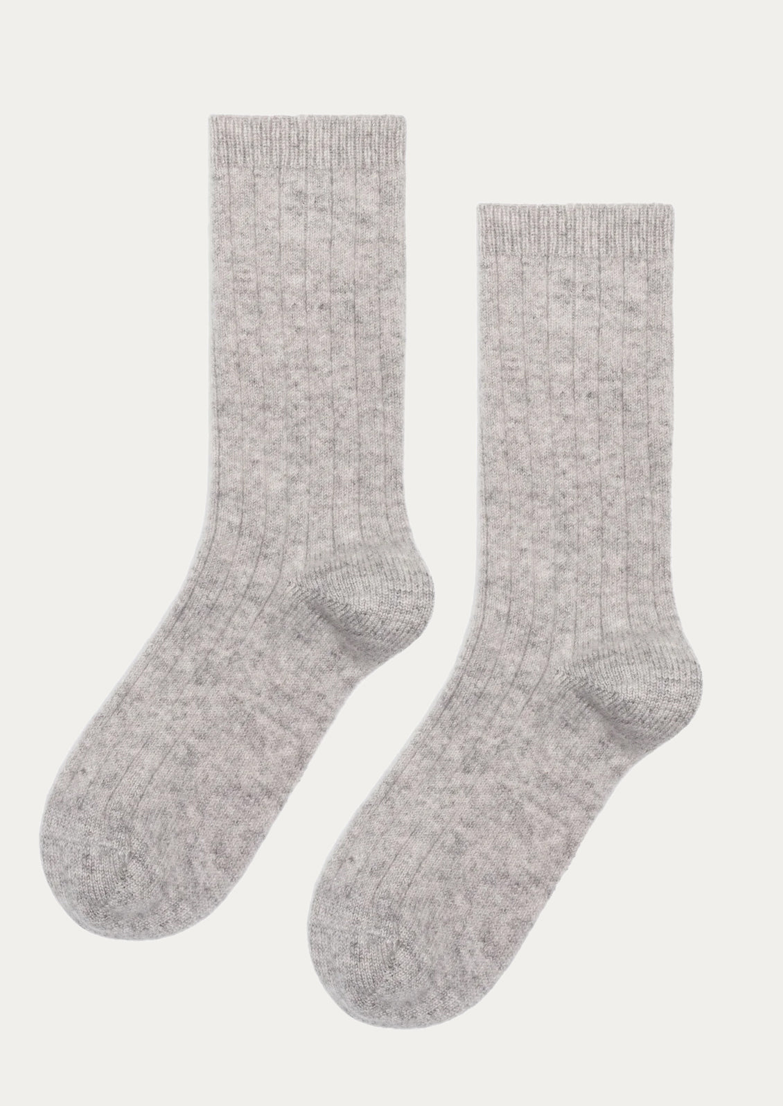 A pair of ribbed cashmere socks in light heather grey.