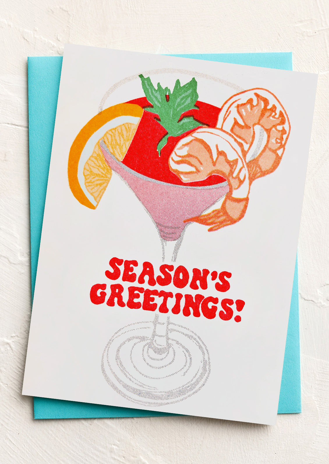 A greeting card with image of shrimp cocktail, text reads "Season's Greetings!".