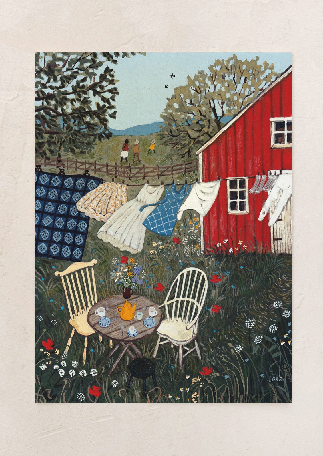 An art print of a country scene with clothesline and tea setting at a small table.