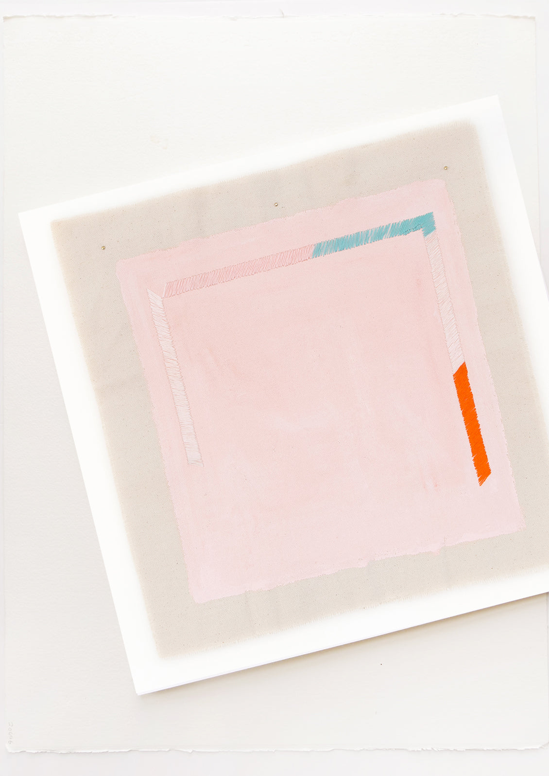 A minimalist abstract print of a pale pink square with small sections of blue, white, and red near its edges.