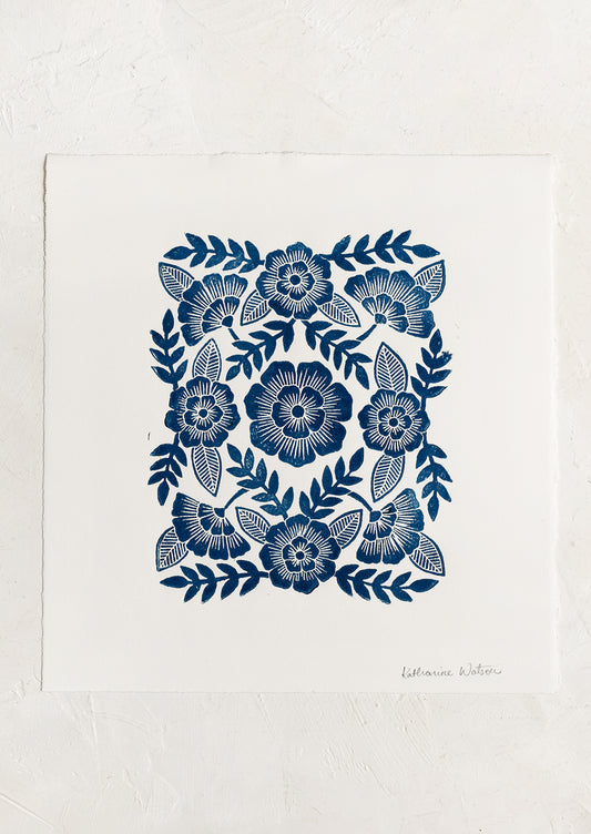 A woodcut floral print block print in indigo ink.