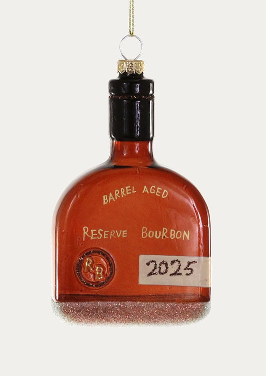 Decorative bottle ornament labeled 'Barrel Aged Reserve Bourbon' with a gold cap on a white background.