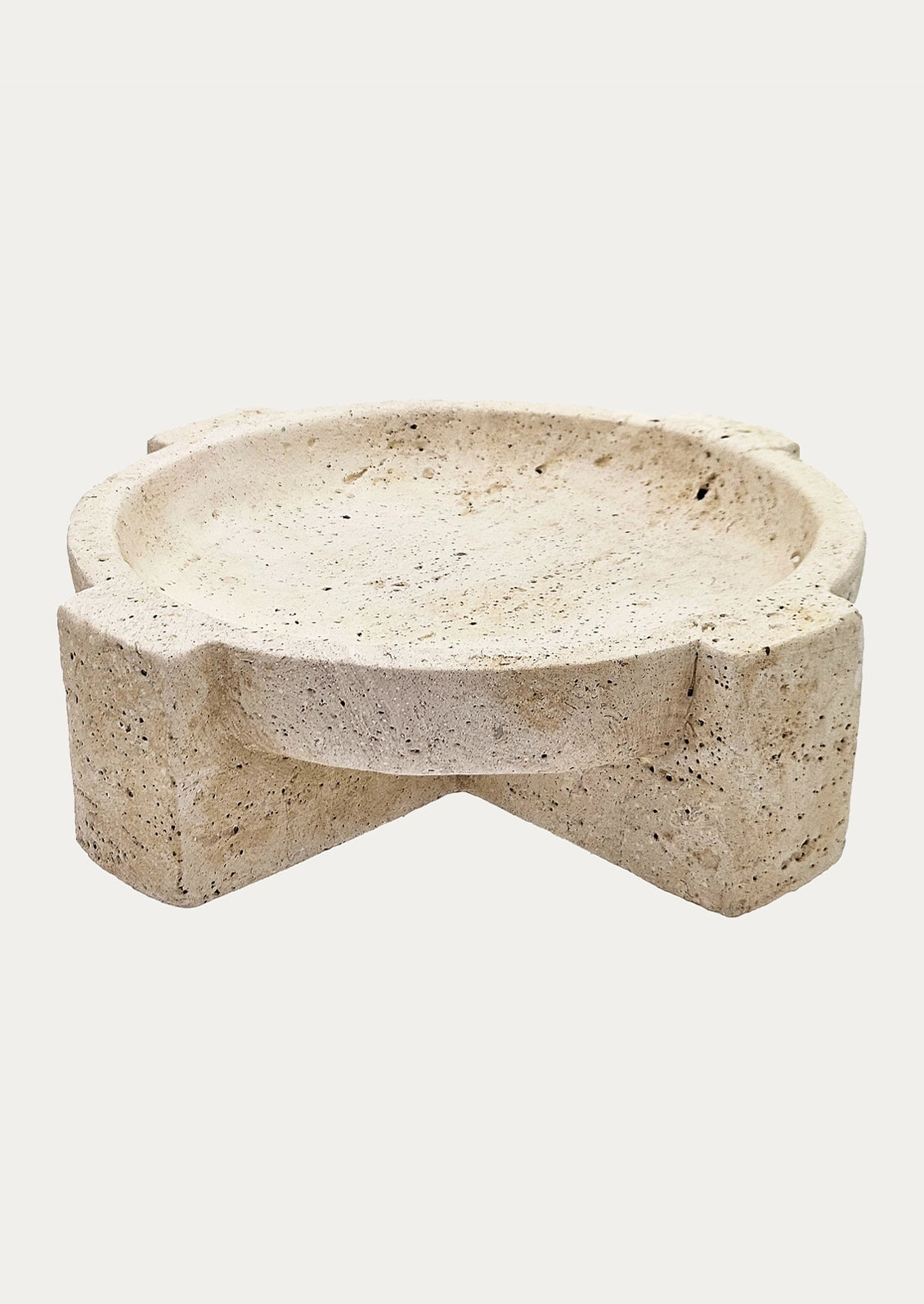A round travertine stone tray.
