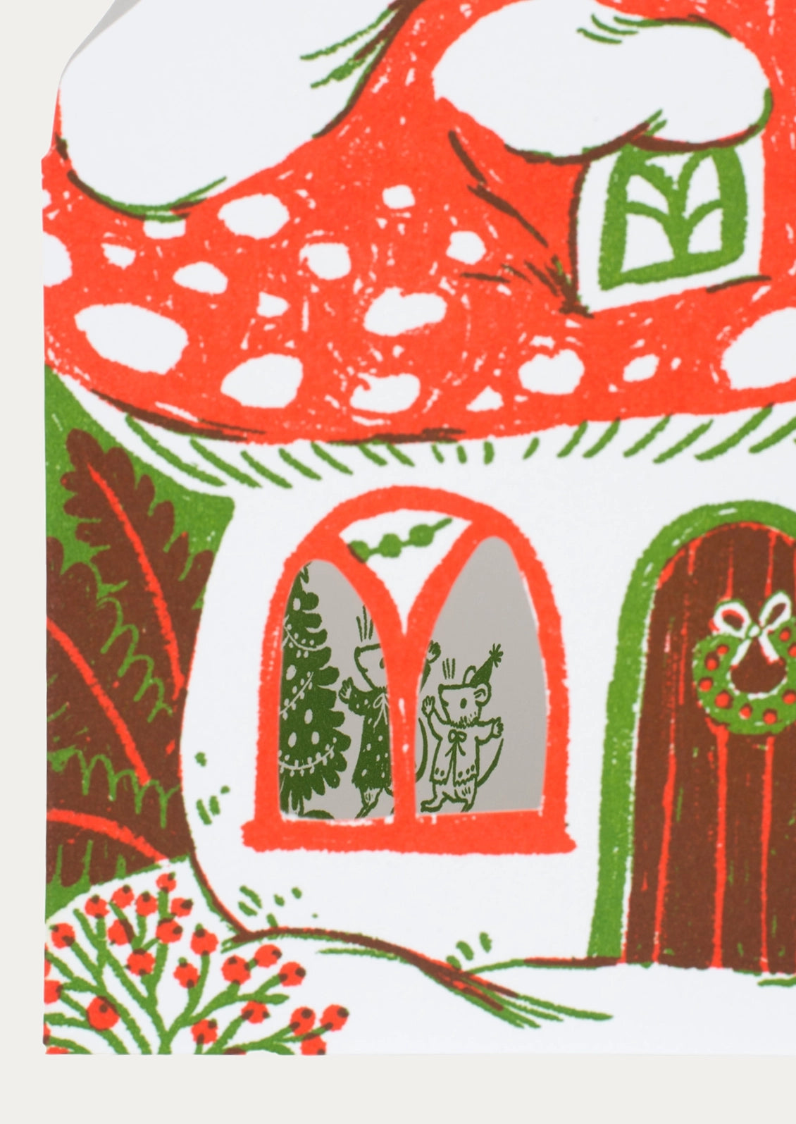 A whimsical illustrated mushroom house with a red-orange roof, white body, green trim, a brown door with a wreath, and holiday figures visible through the windows, shown on a light neutral background.