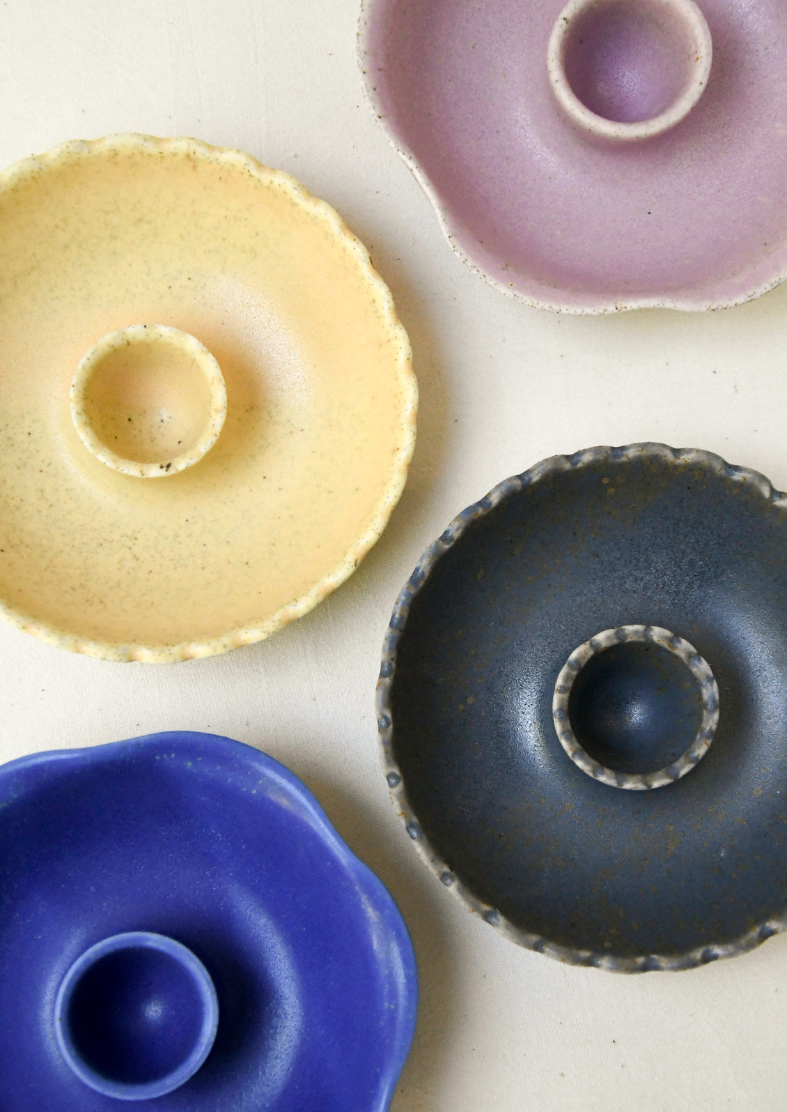 Taper candle holders in a variety of colors.