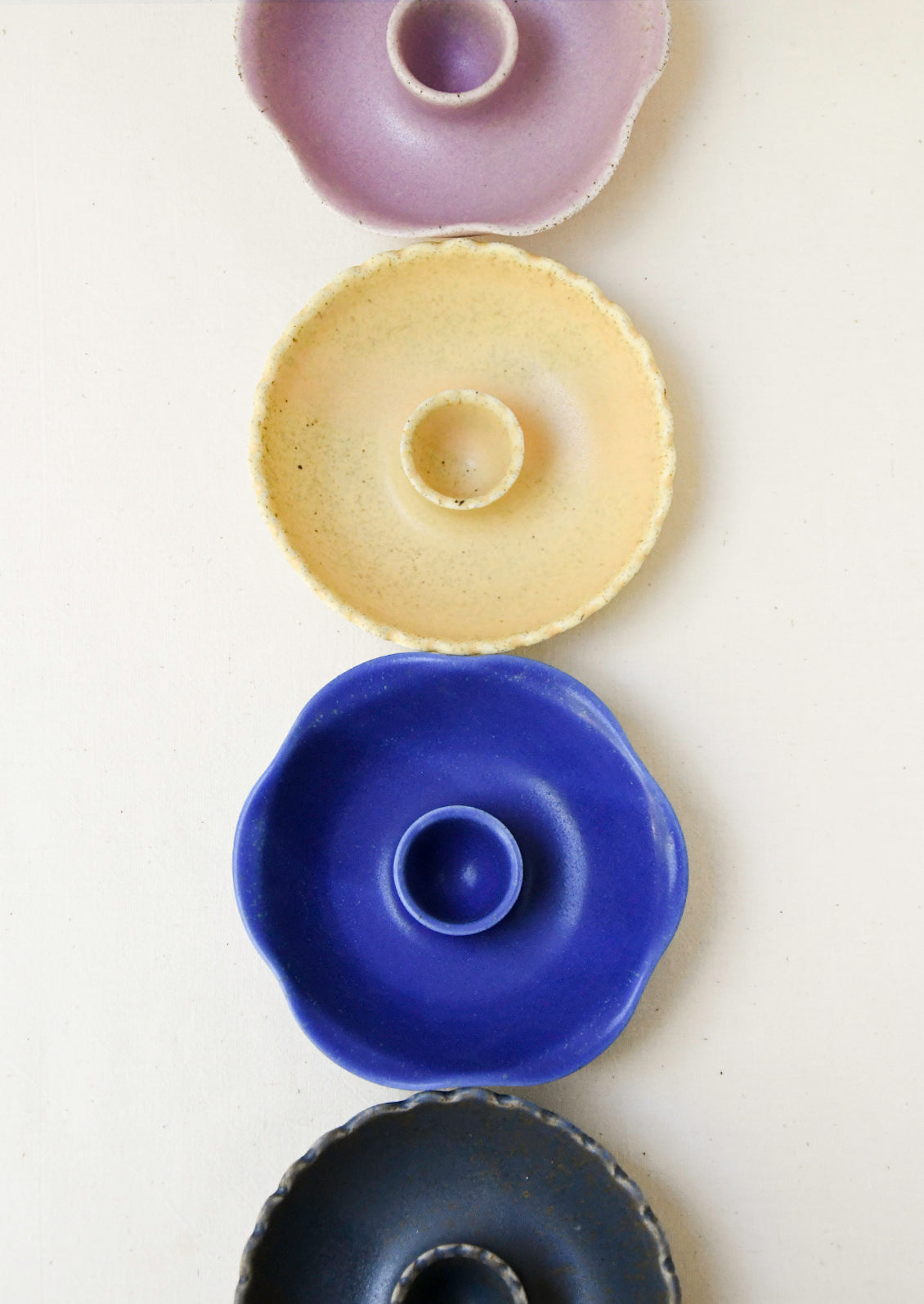 Taper candle holders in a variety of colors.