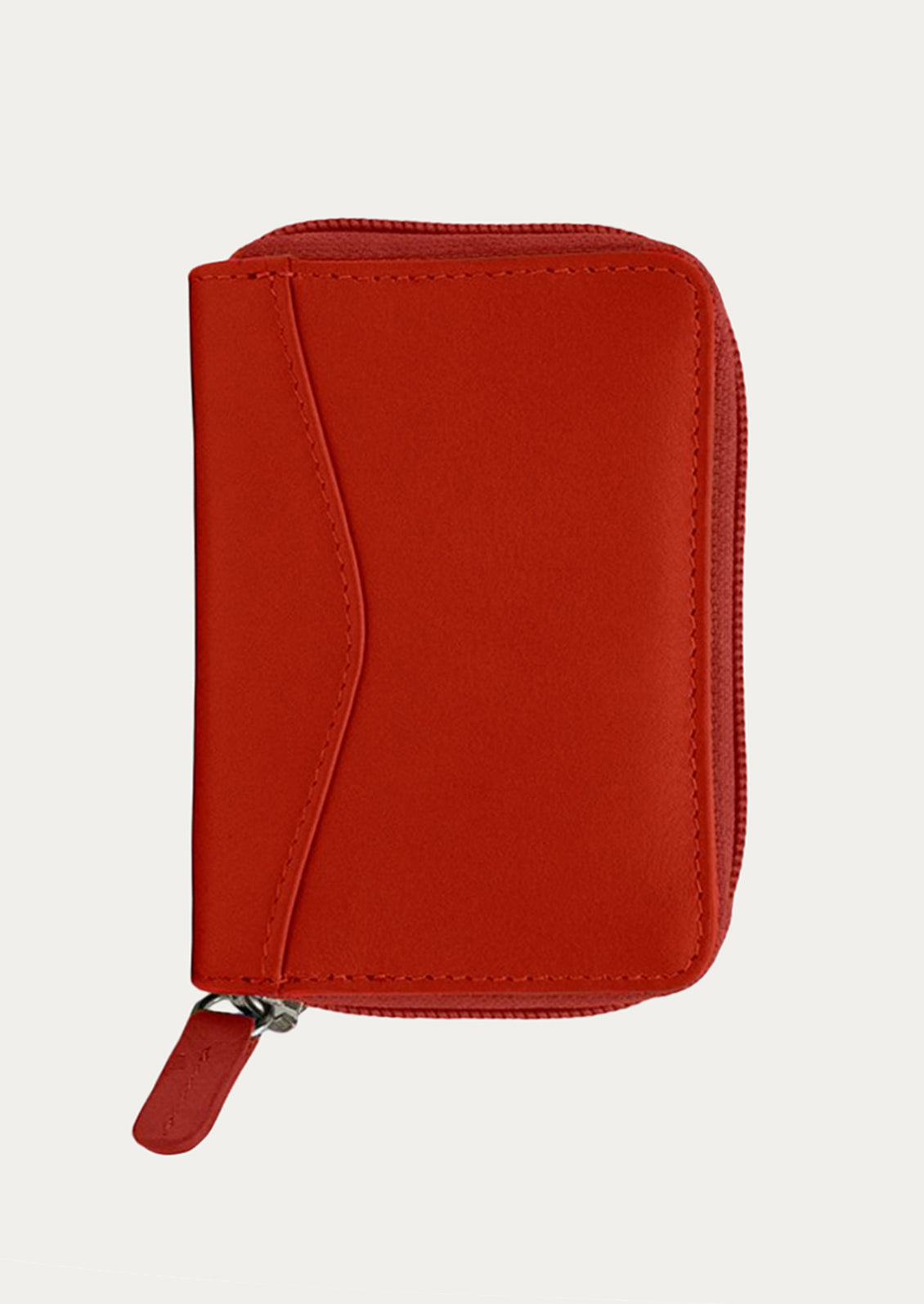 A leather card wallet in red.