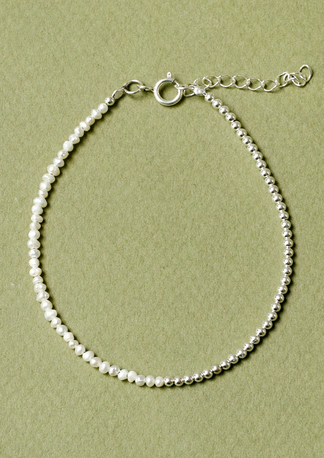 A bracelet with sterling silver beads and small freshwater pearls.