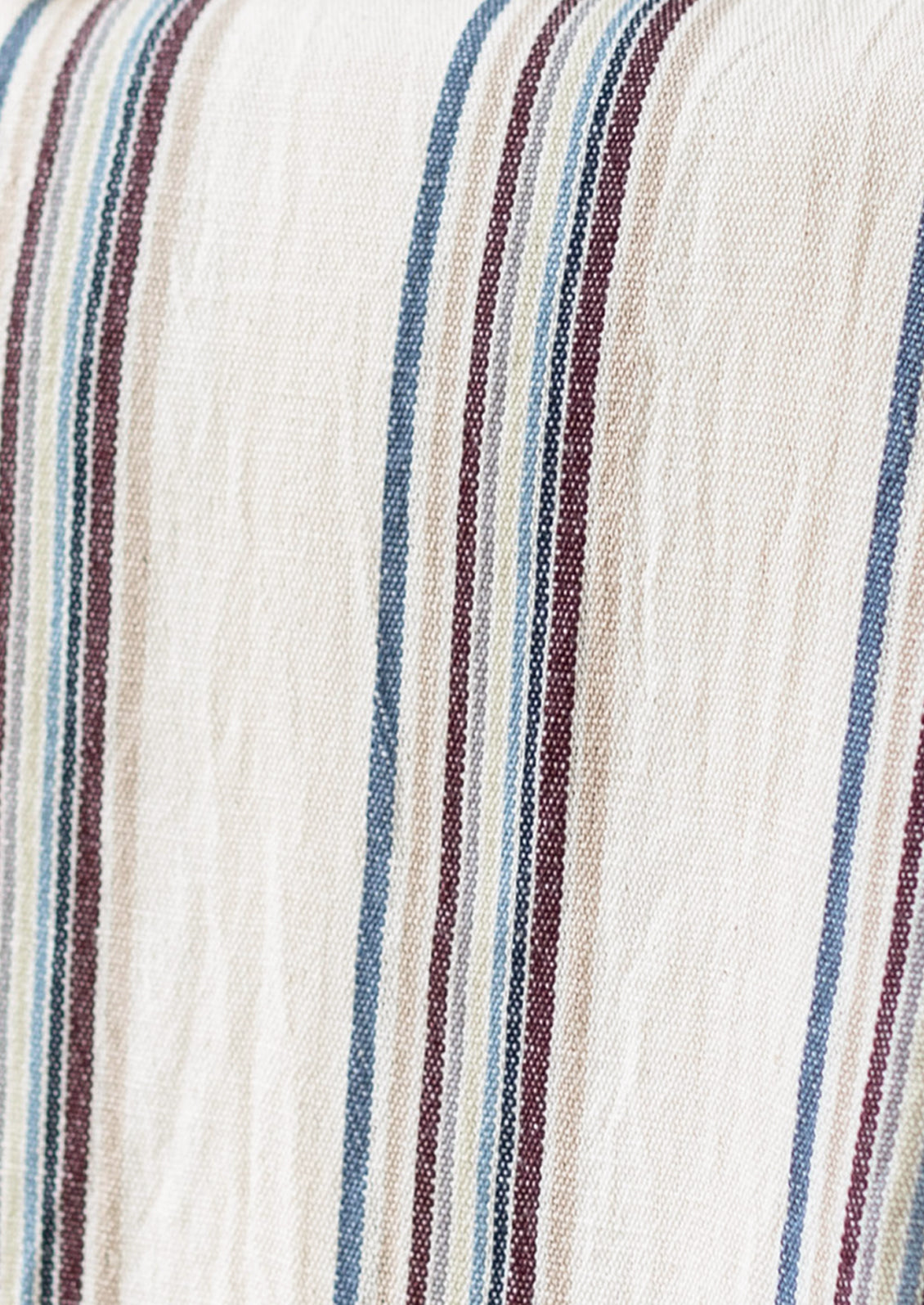 Close-up of a striped fabric with vertical bands of cream, dusty blue, burgundy, and dark brown.
