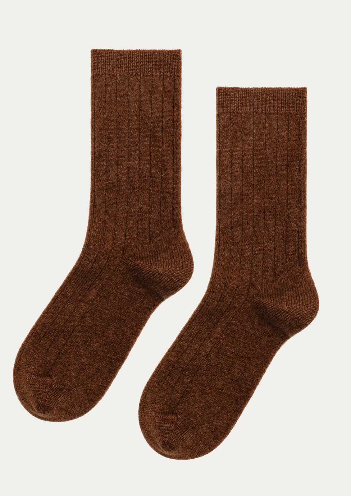 A pair of ribbed cashmere socks in brown.