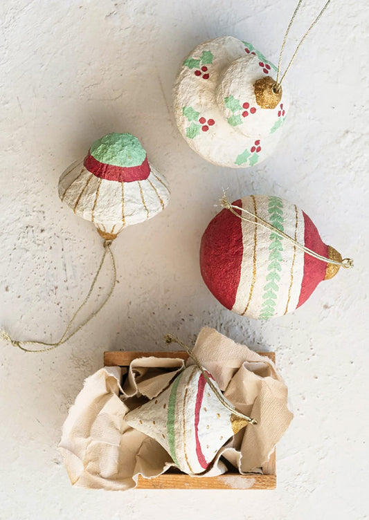 Paper mache ornaments painted red, green and gold.