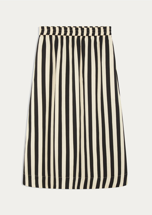A person wearing a beige and black vertical stripe skirt.