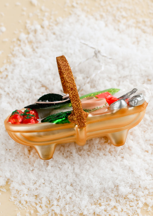 A glass ornament of a garden trug.