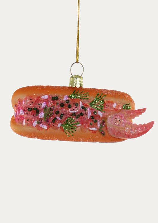 A glass ornament depicting a lobster roll.