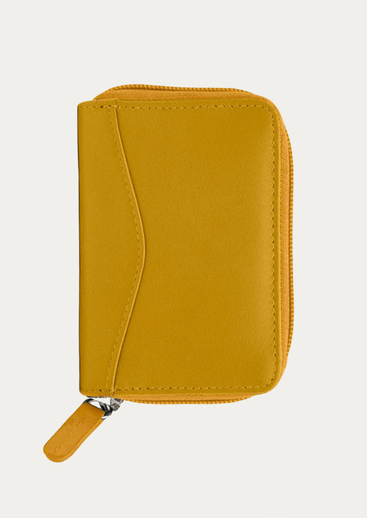 A leather card wallet in mango yellow.