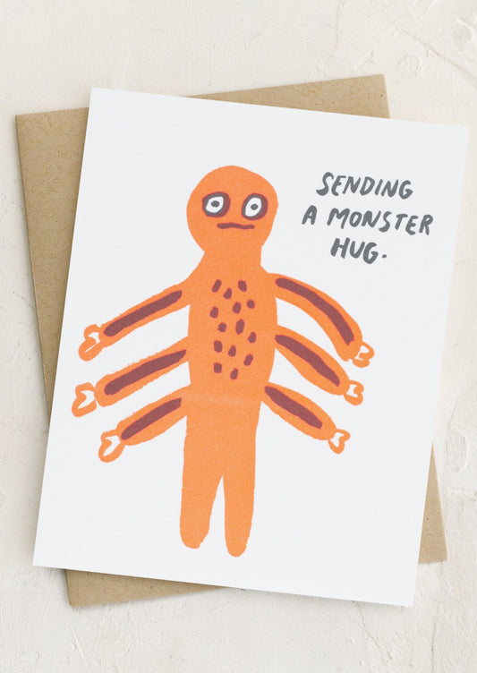 A card with illustration of monster with 6 arms, text reads "Sending a monster hug".