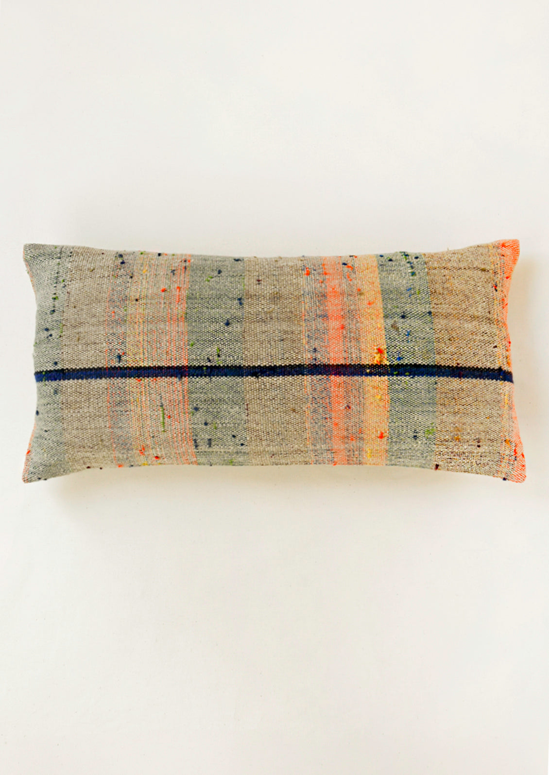 A rectangular 12" x 24" mottled kilim pillow with various colored striped throughout.