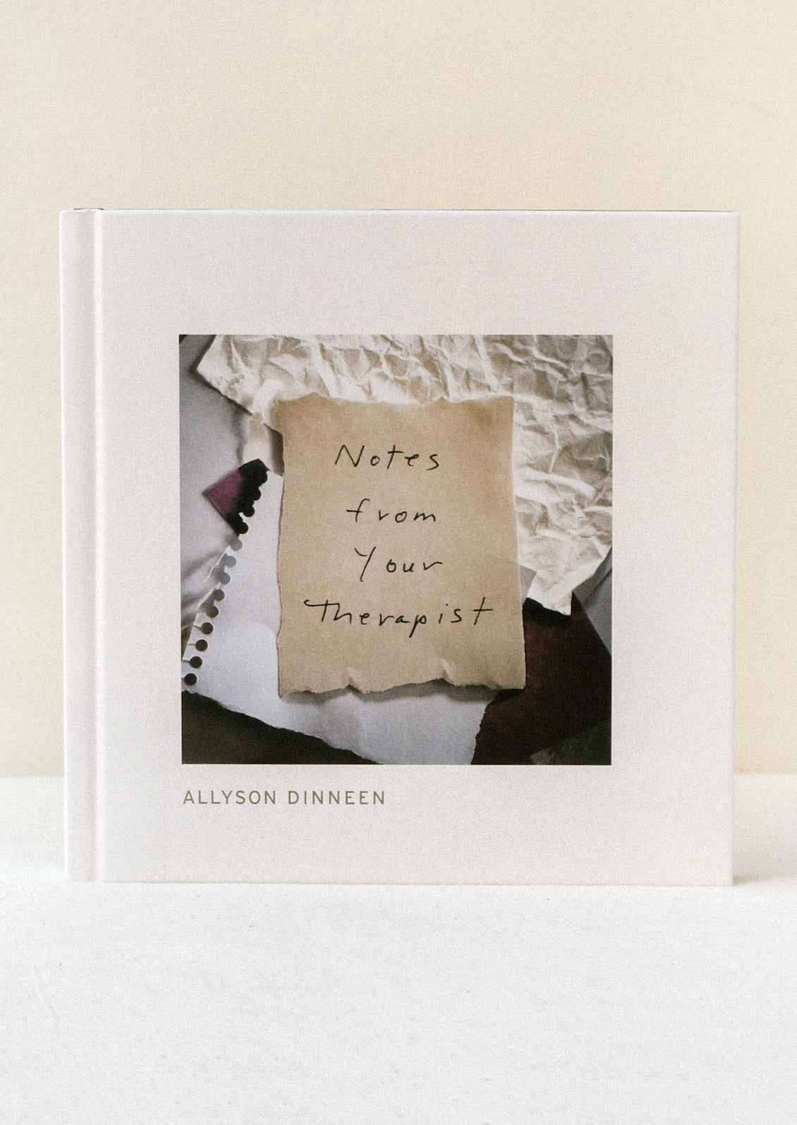 A book titled 'Notes from your Therapist' by Allyson Dinneen.