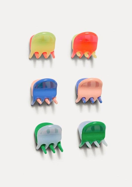 A set of 6 colorful mini hair claws.