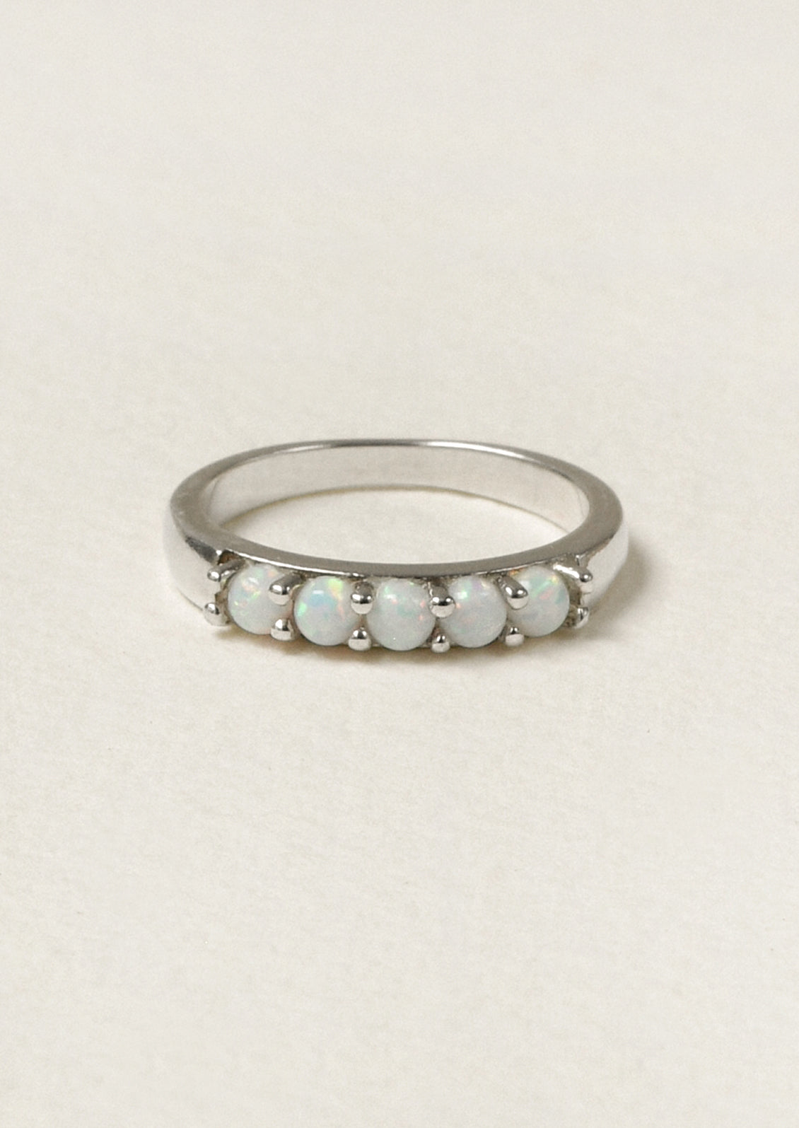 A sterling silver ring adorned with 5 opals.