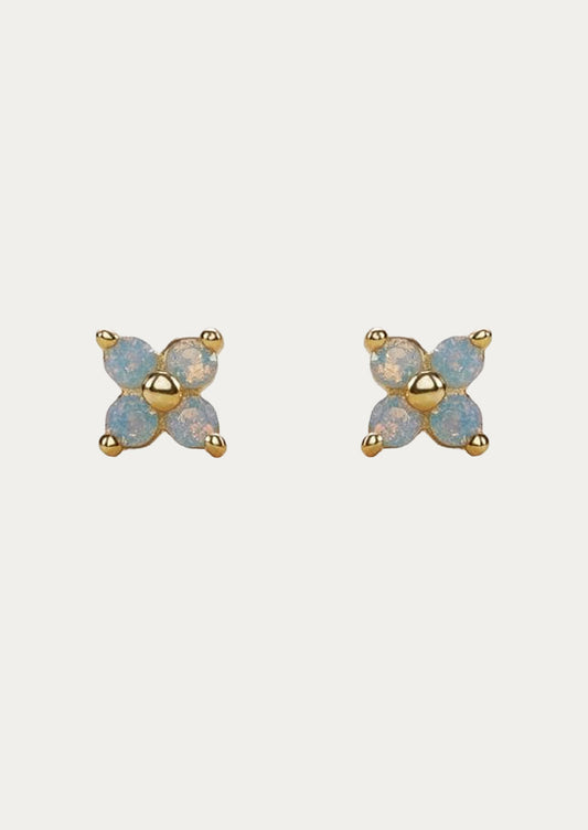 A pair of gold stud earrings with periwinkle flowers.
