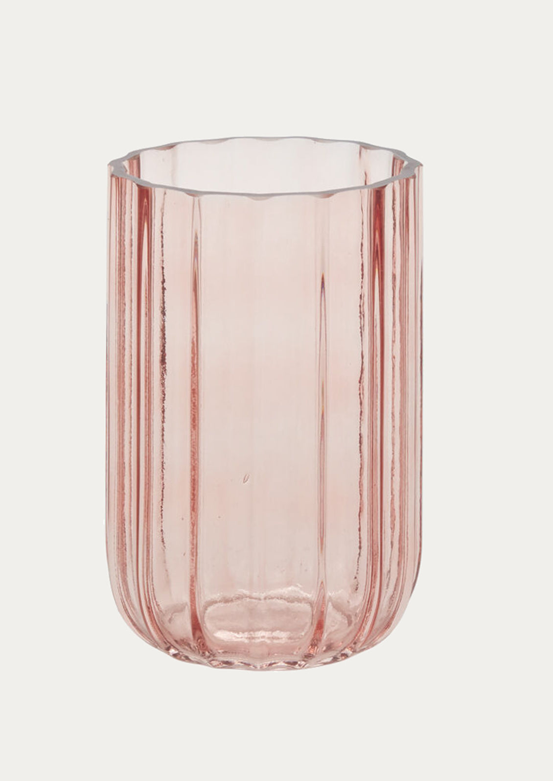 A pink ribbed glass vase.
