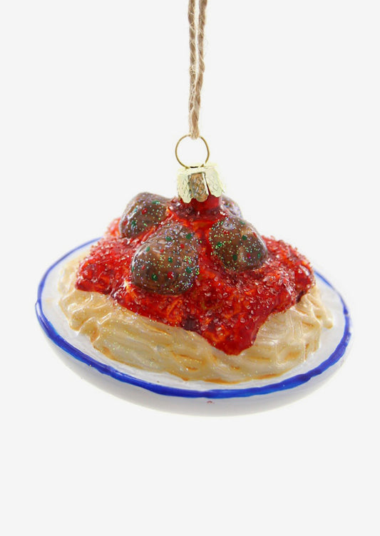 A glass holiday ornament of a plate of spaghetti and meatballs.