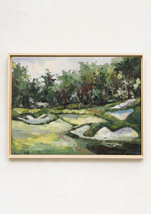 A framed original oil painting of a hilly countryside setting.