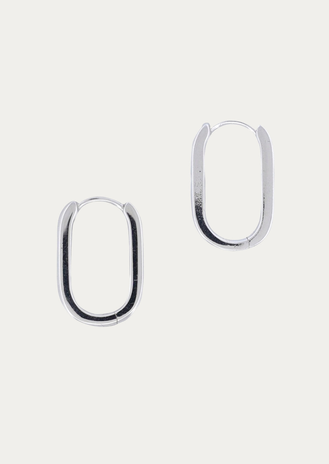 A pair of sterling silver hoop earrings.