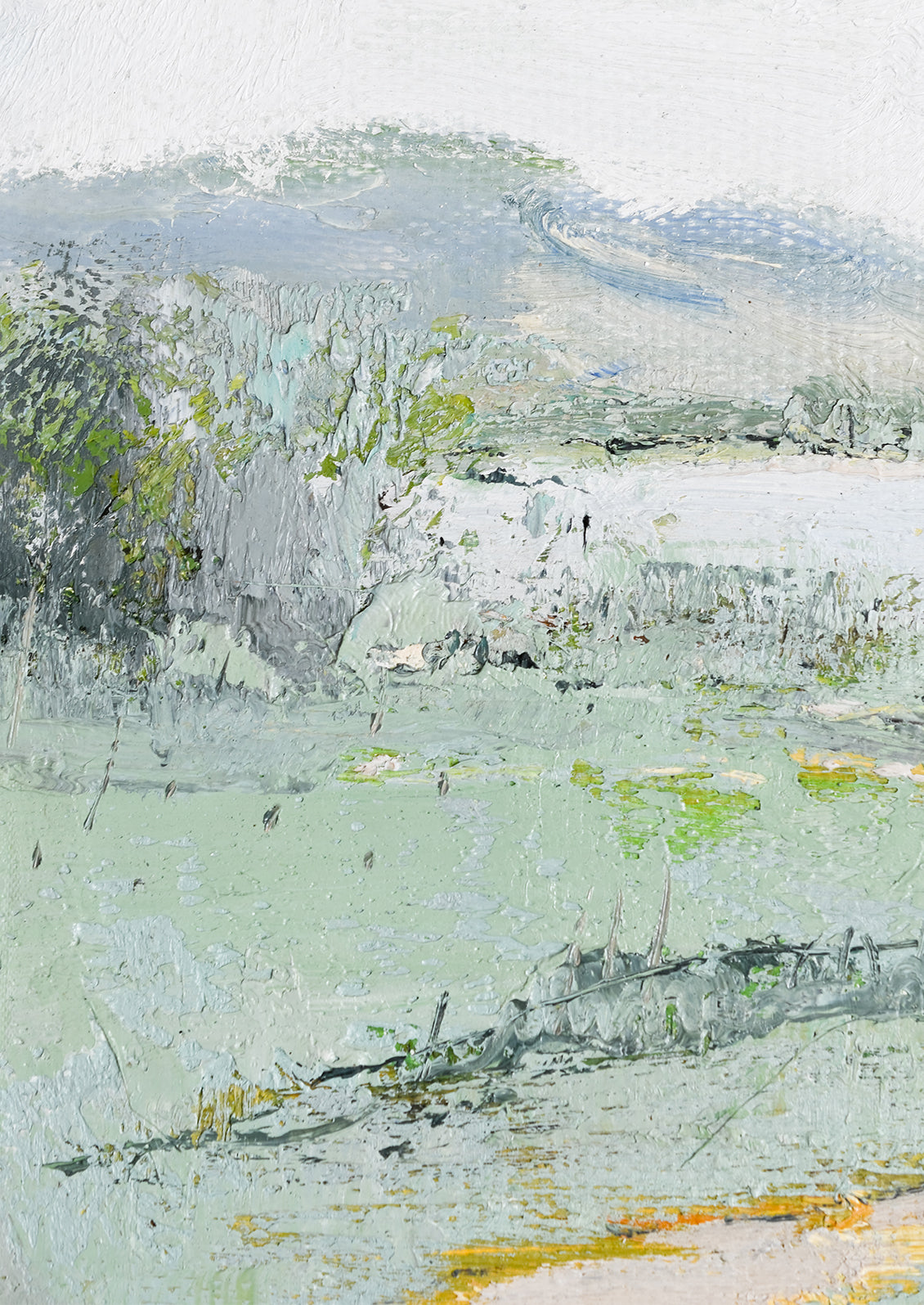 A framed original painting of a cool-colored lakeside landscape setting.
