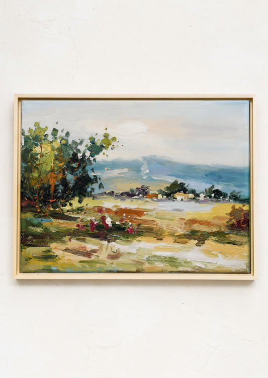 An original oil painting of a landscape in the country.