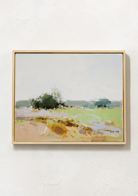 An original painting on unstretched canvas depicting a colorful meadow with trees on the horizon line.
