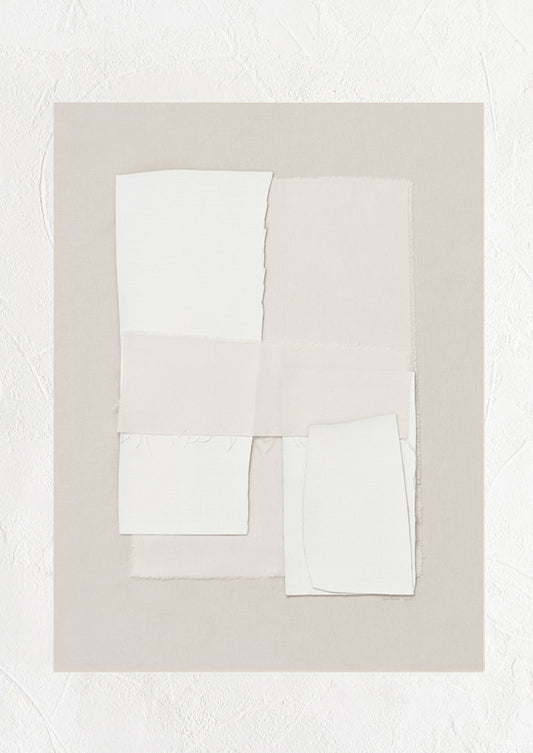 A beige art print with layered ivory textile.