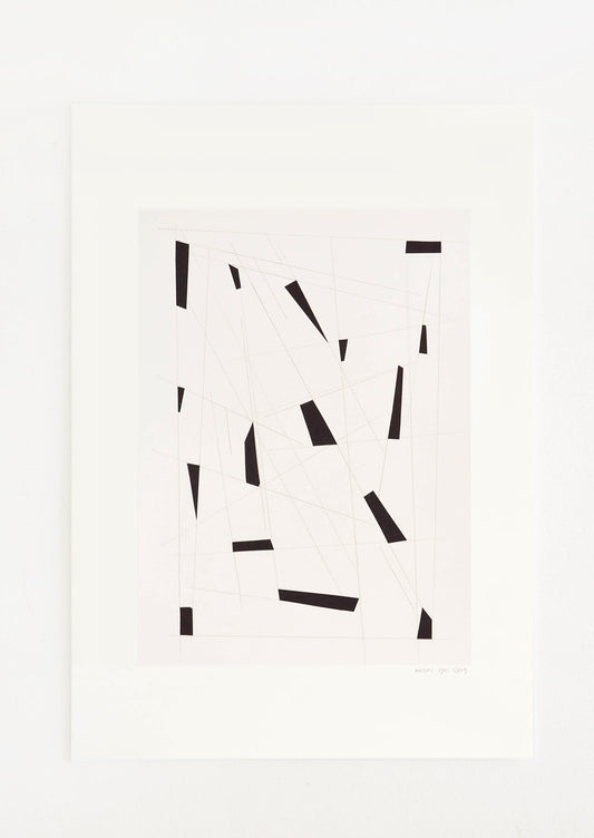 Small black trapezoidal shapes sit in a pale gray negative space. 