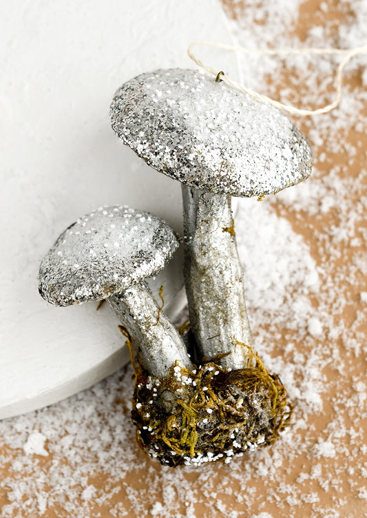 A holiday ornament of double mushroom in silver.