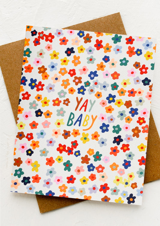 A card with neon allover floral print, text at center reads "YAY BABY".