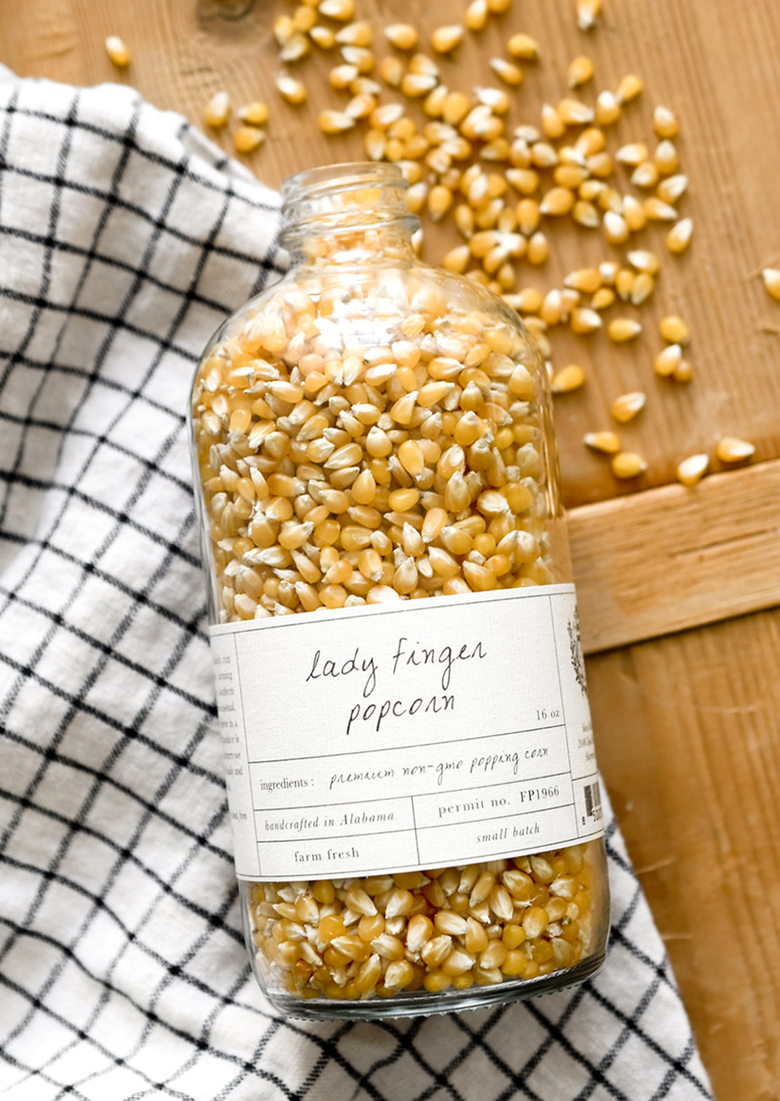 A glass bottle of small kernel popcorn.