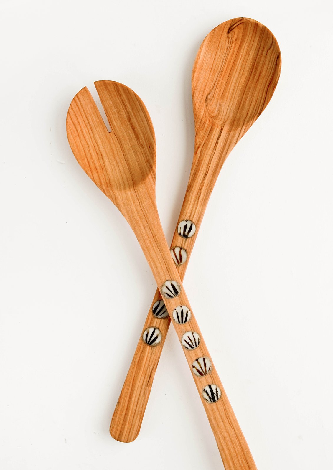 Pair of wooden salad serving spoons with round bone inlay detailing on handles