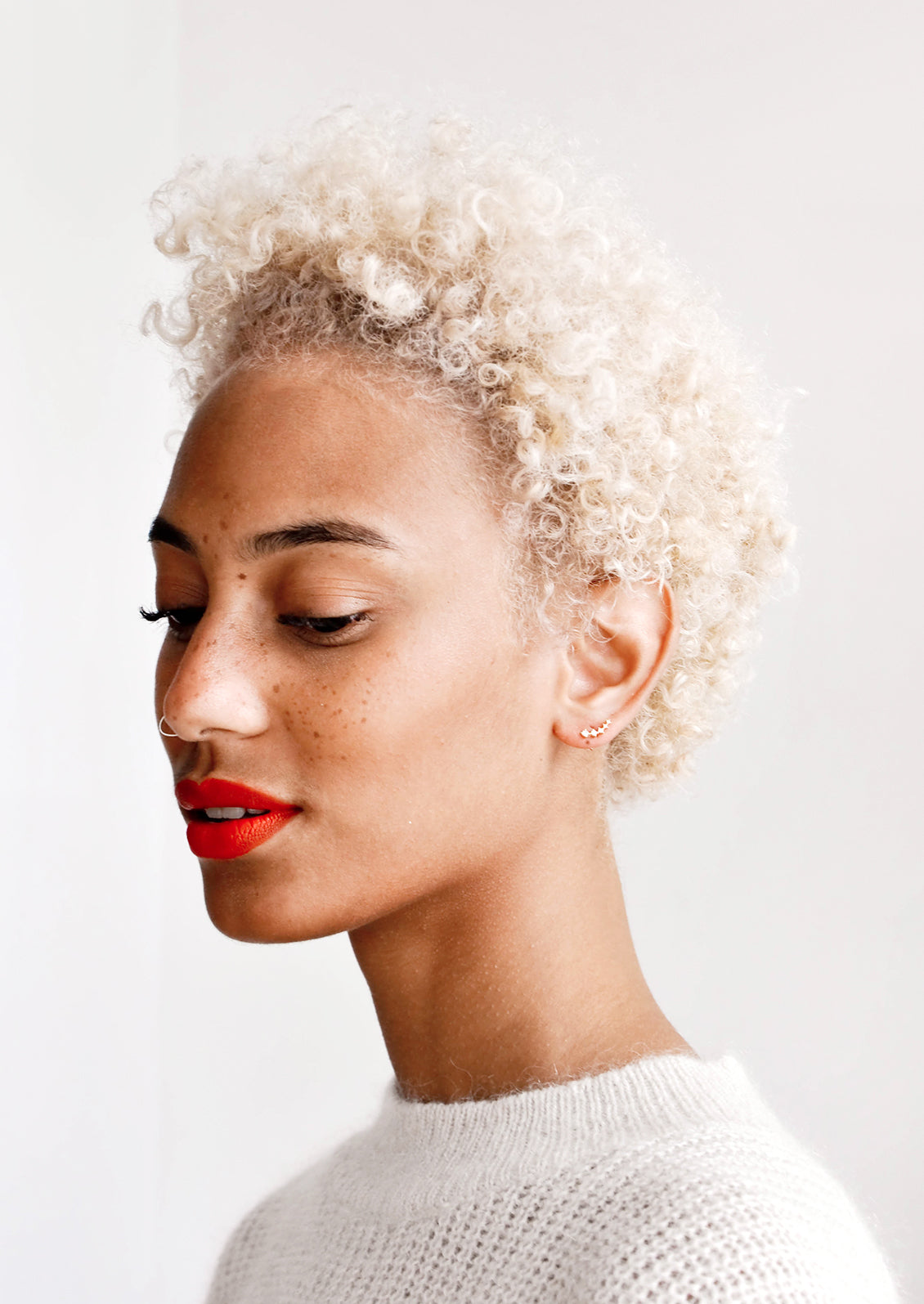 Model wearing crystal climber stud earrings