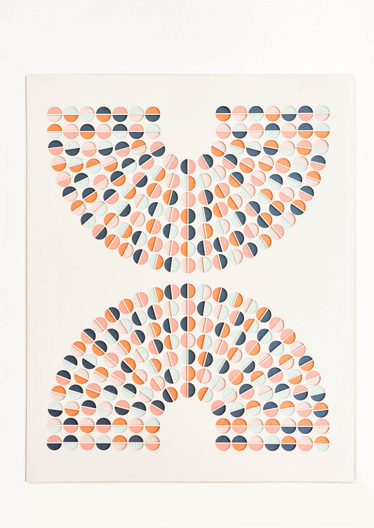 Artwork with lasercut, mirrored arc shapes composed of colorblocked circles