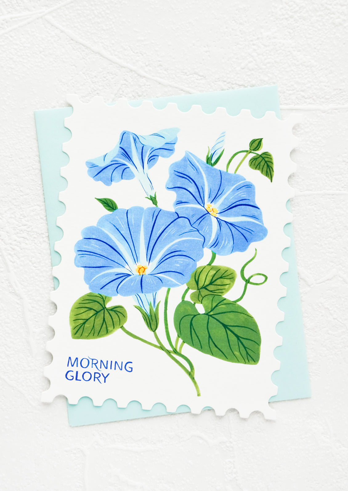 Diecut greeting card in the shape of a postage stamp, printed graphic of Morning Glory floral.