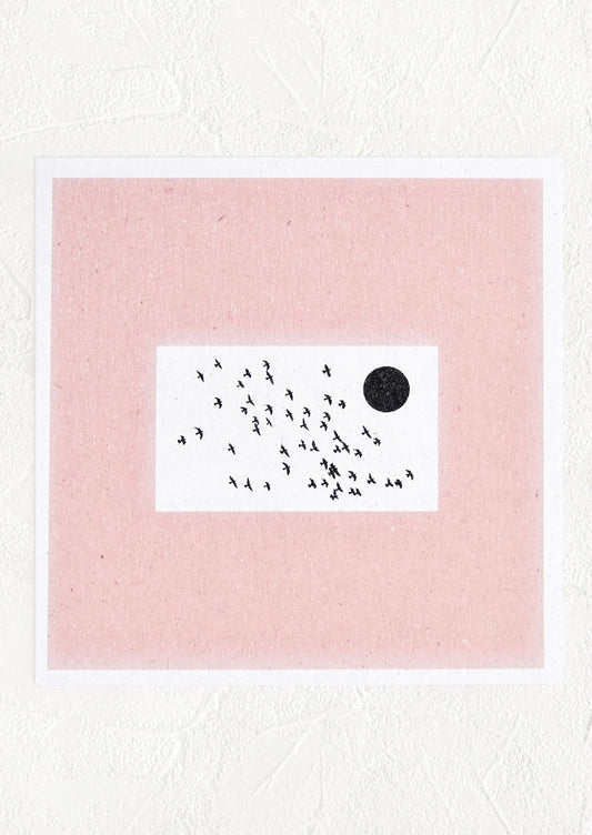 A square digital art print with thick pink border and centered image of flock of birds flying around the sun.
