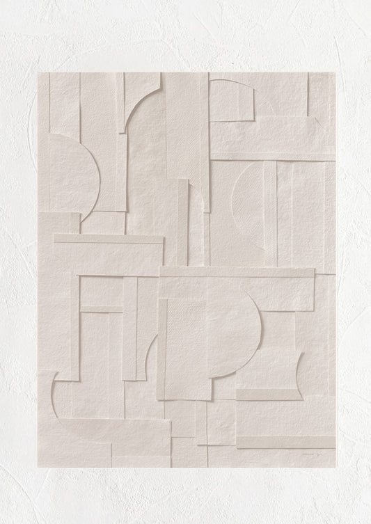 An art print featuring geometric cutout shapes of neutral paper, pieced together.