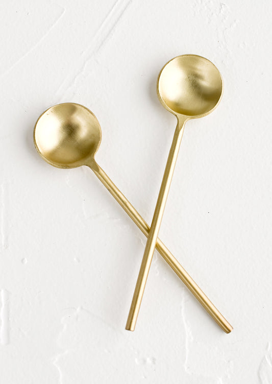 Two small golden spoons.