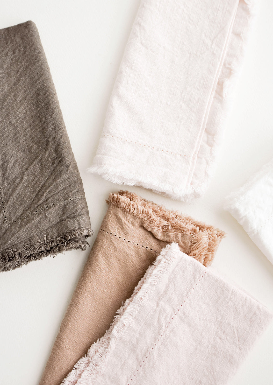  Cotton Napkins with frayed edges in browns and pinks.